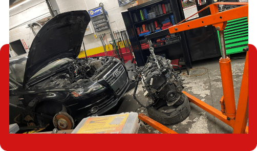 Audi repair in Hanover, PA. Open hood of an Audi showing the car's engine.