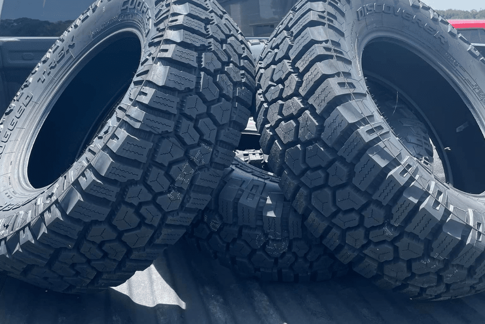 Tire repair in Hanover, PA by Alex’s Autoworks. Image of all-terrain Cooper Discoverer Rugged Trek tires, showcasing the shop’s commitment to traction, durability, and safe performance for off-road and daily driving needs.