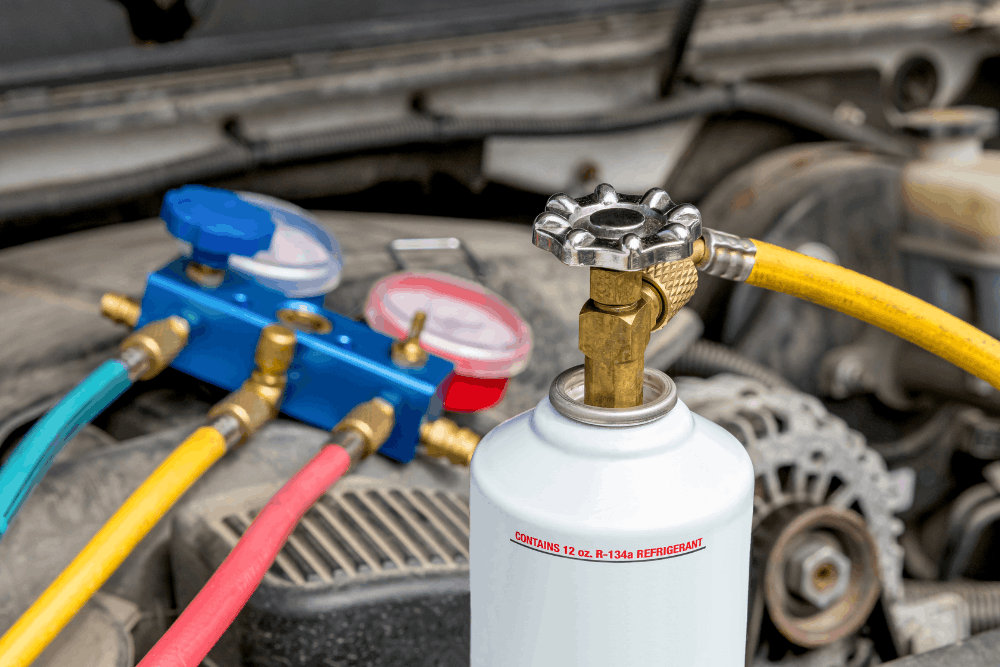 Car a/c repair, auto repair in Hanover, PA at Alex’s Autoworks. Image of automotive air conditioning recharge equipment and refrigerant gauges connected to a vehicle during professional A/C diagnostics and cooling system service.