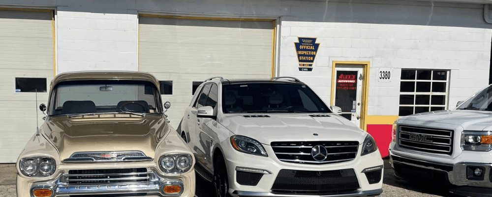 PA State Inspection in Hanover, PA at Alex’s Autoworks. Image of shop exterior with classic and modern vehicles, highlighting trusted service for domestic and European cars with quality workmanship and reliable care.