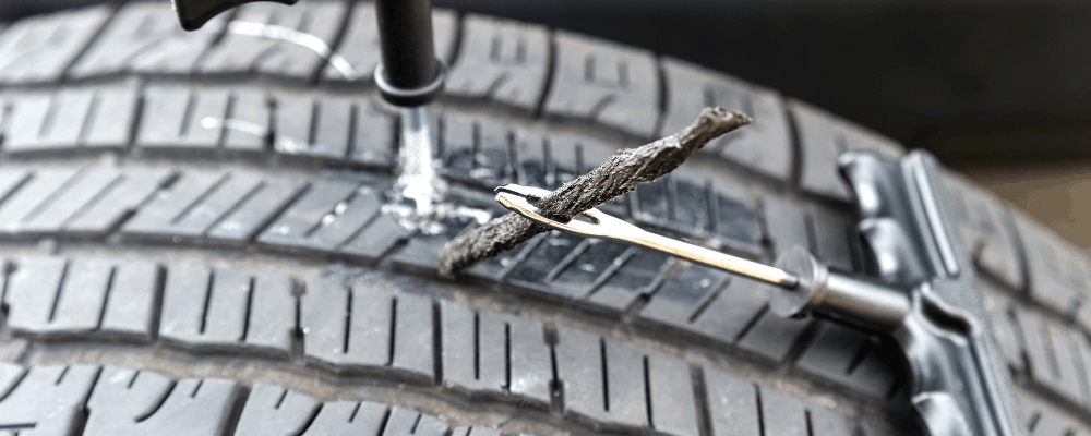 Tire repair in Hanover, PA by Alex's Autoworks. Image of a professional tire plug repair being performed to safely seal a puncture, highlighting attention to detail and commitment to restoring tire safety and reliable road performance.