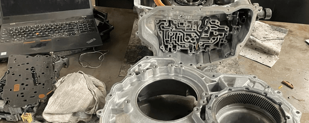 Transmission repair in Hanover, PA by Alex’s Autoworks. Image of a disassembled transmission with gears and components exposed, showcasing the shop’s precision, expertise, and commitment to restoring peak vehicle performance.
